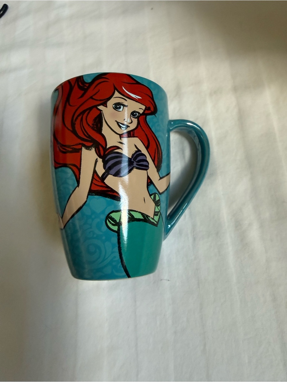 A vintage Disney The Little Mermaid Ariel Once I Wake Up teal ceramic coffee mug